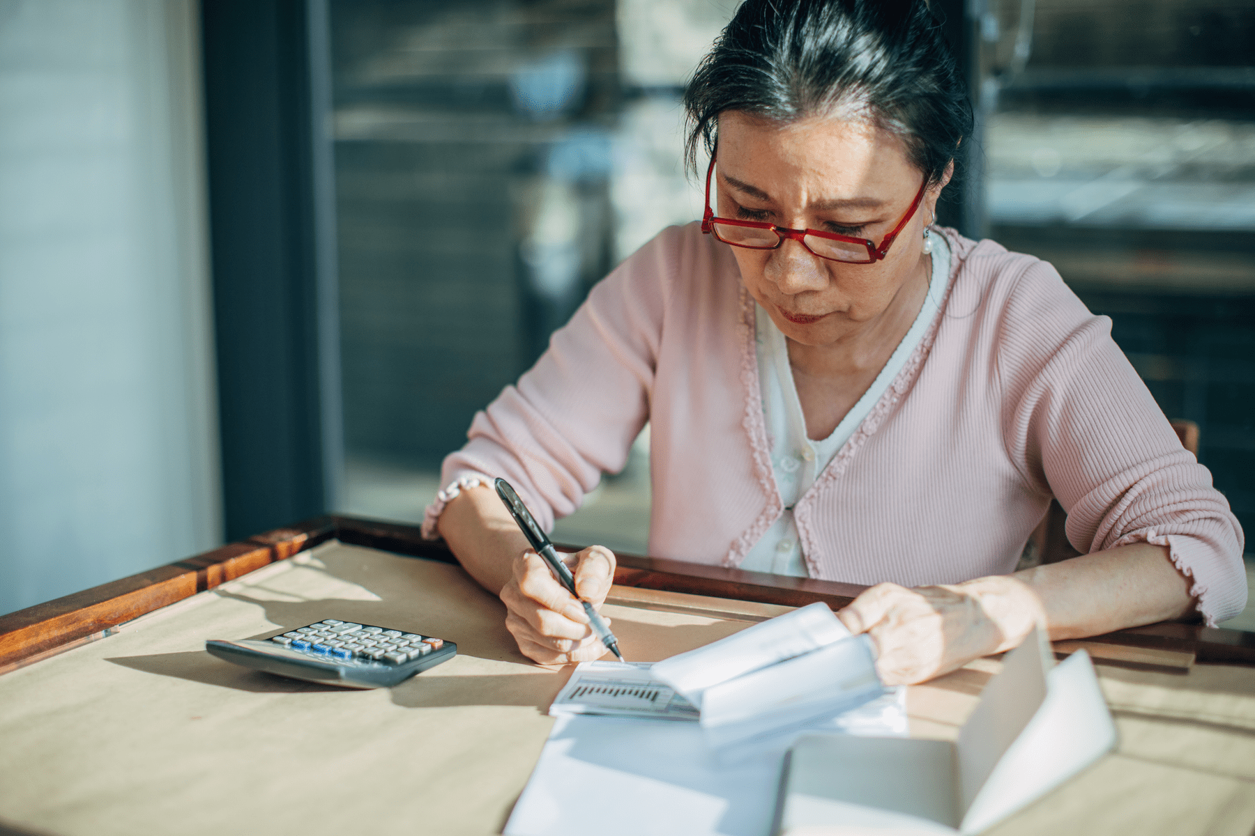 woman sits at desk